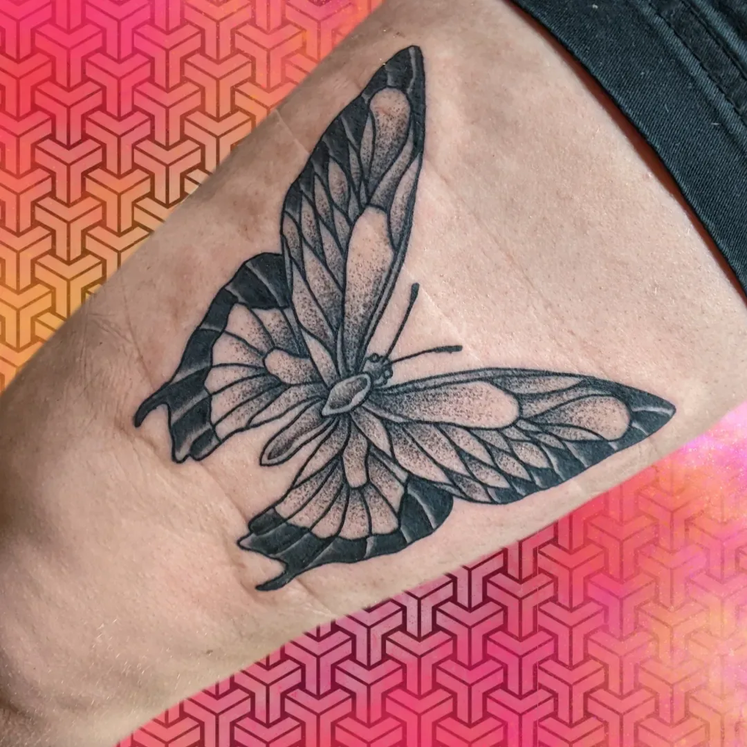 Black grey butterfly tattoo bicep raleigh