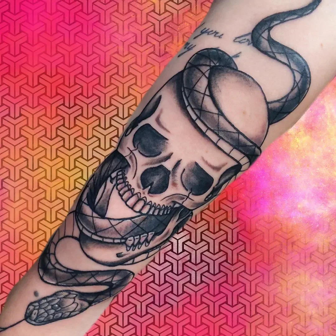 Skull snake forearm tattoo raleigh