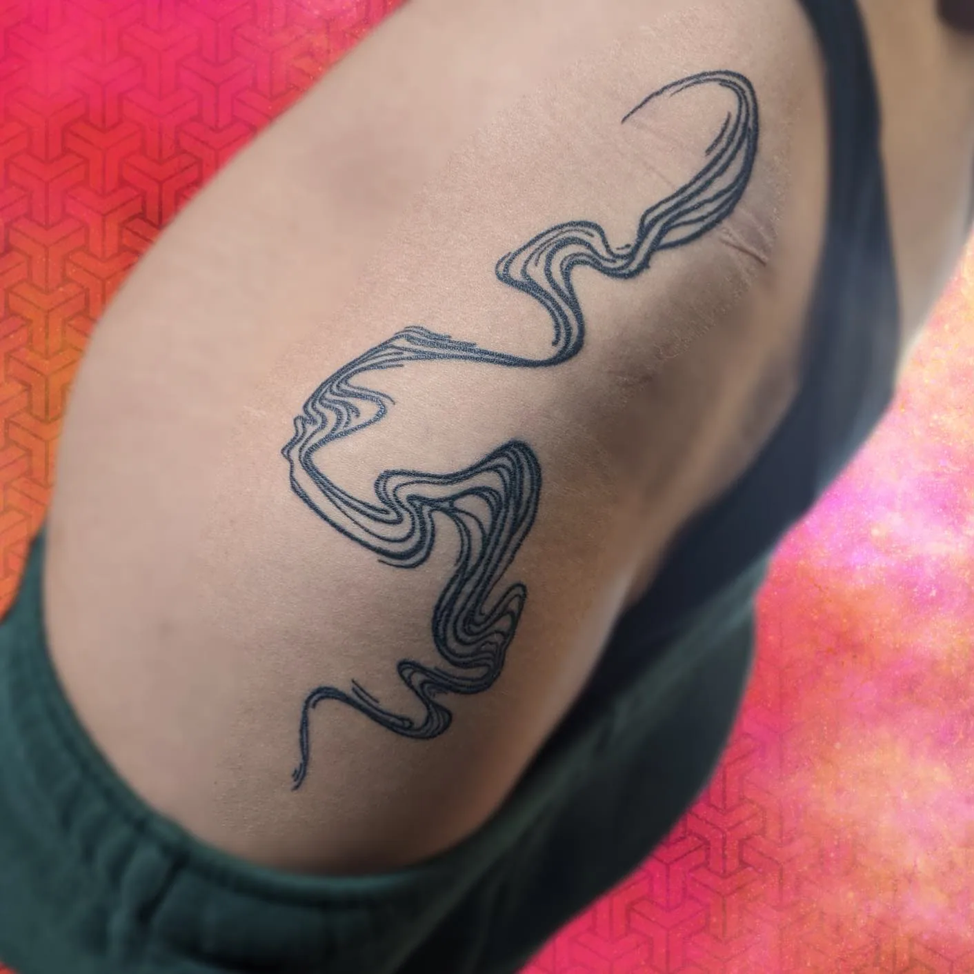 Wavy linework shoulder tattoo raleigh