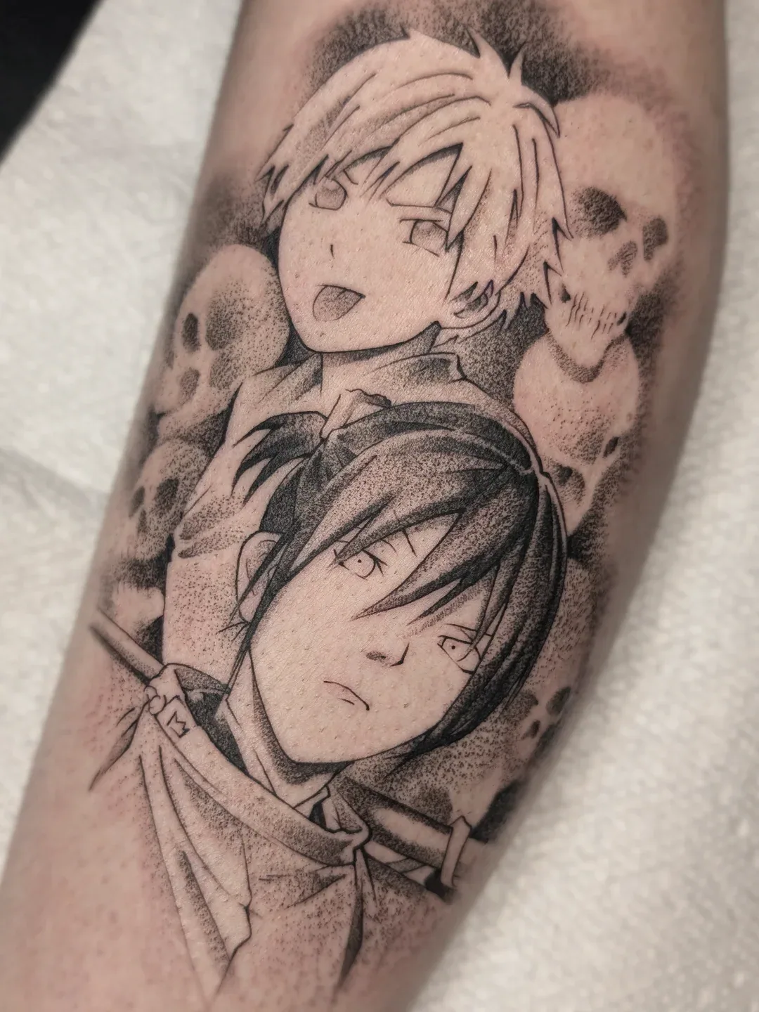 Anime duo skulls forearm tattoo raleigh