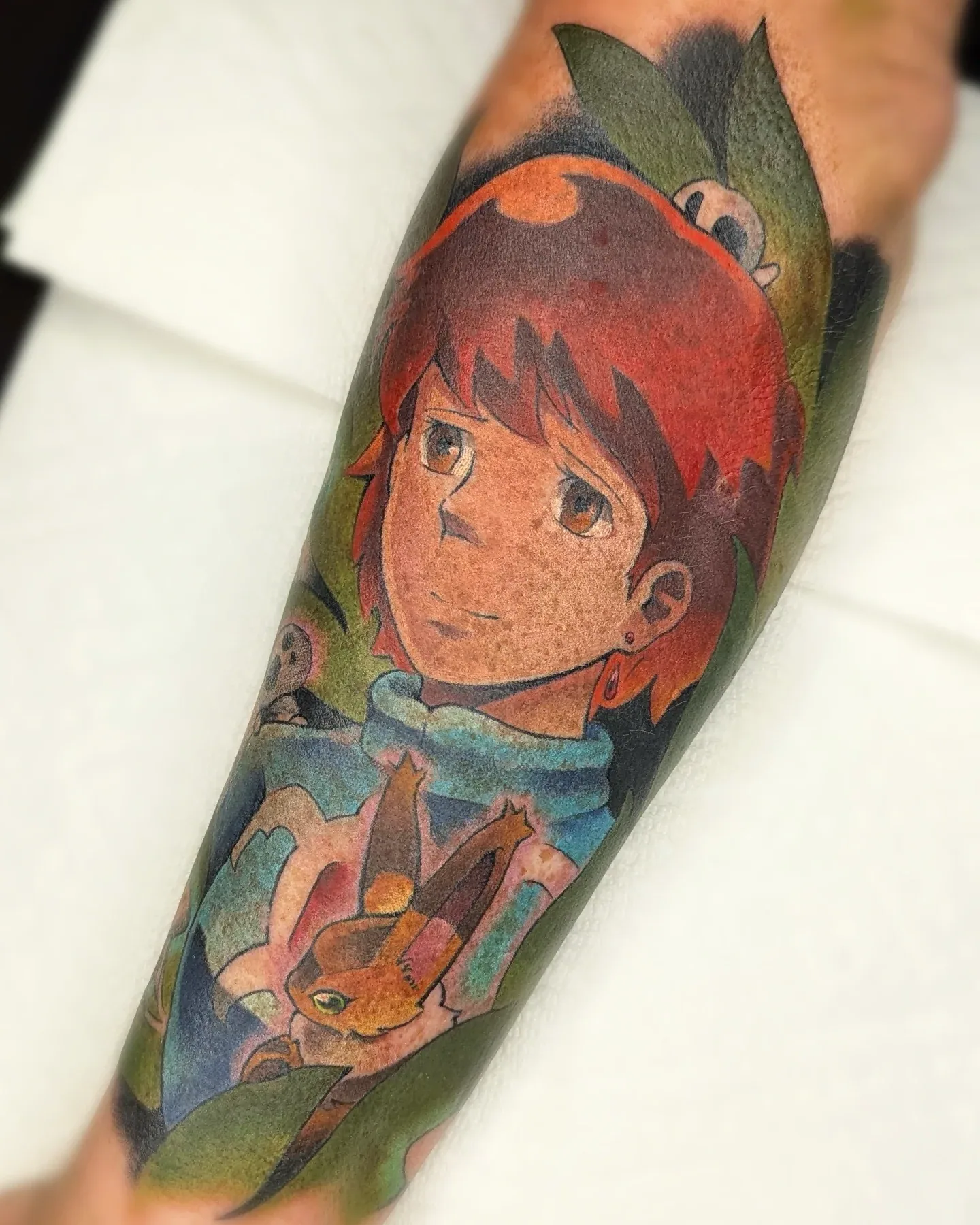 Anime girl fox companion forearm tattoo raleigh