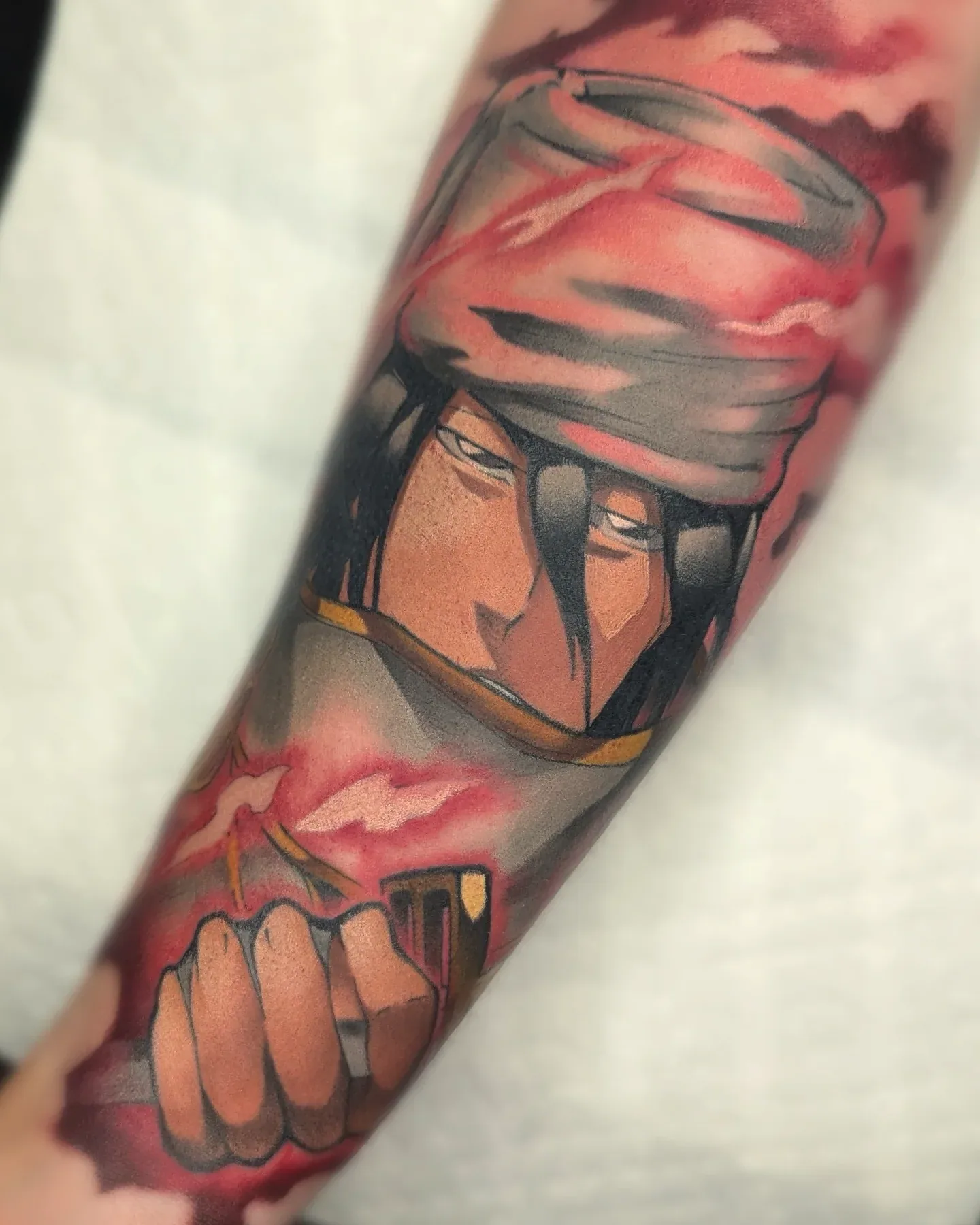 Anime headband fist forearm tattoo raleigh