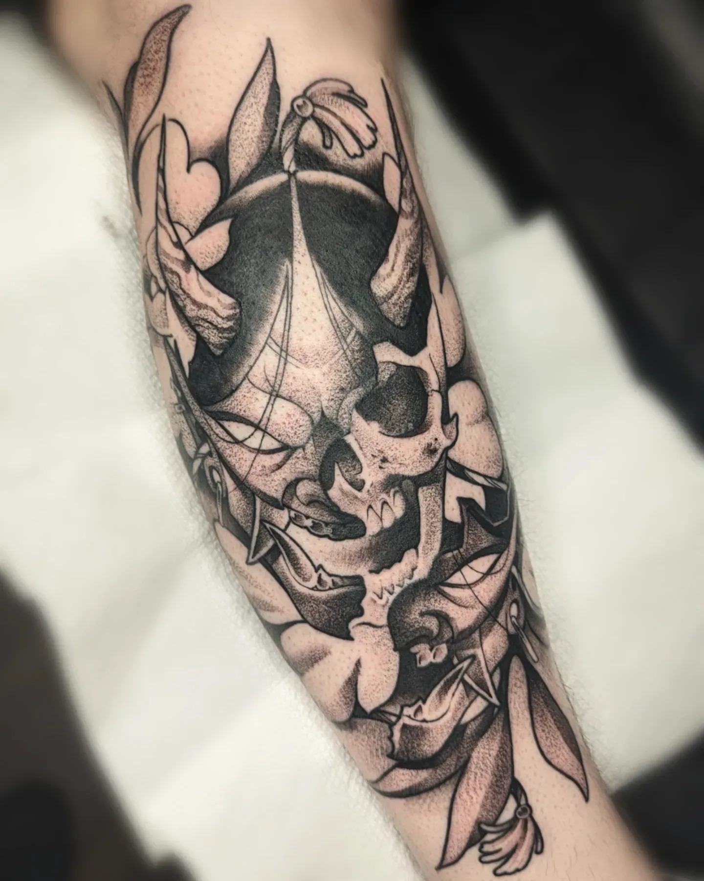 Black grey skull forearm tattoo raleigh