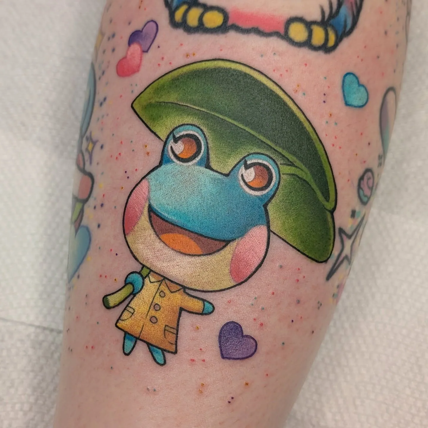 Color frog leaf umbrella arm tattoo raleigh