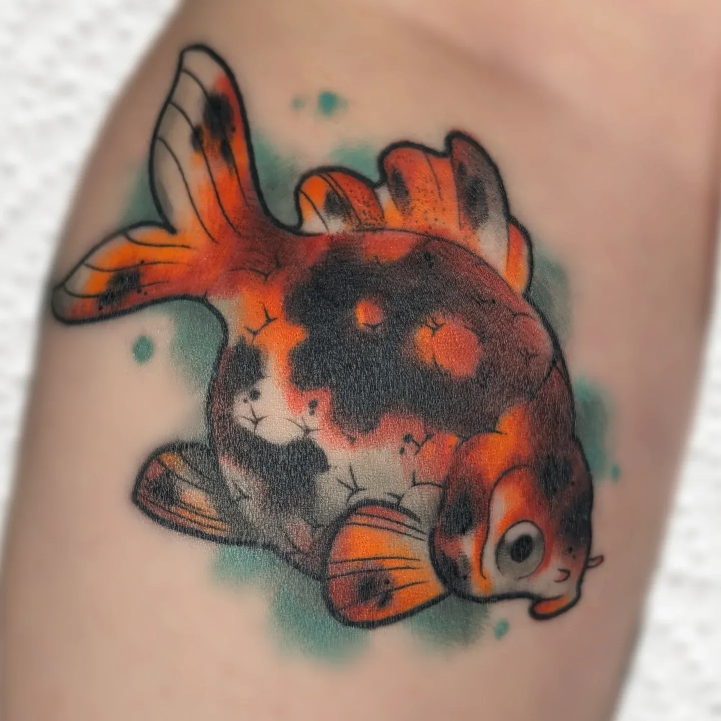 Color goldfish arm tattoo raleigh