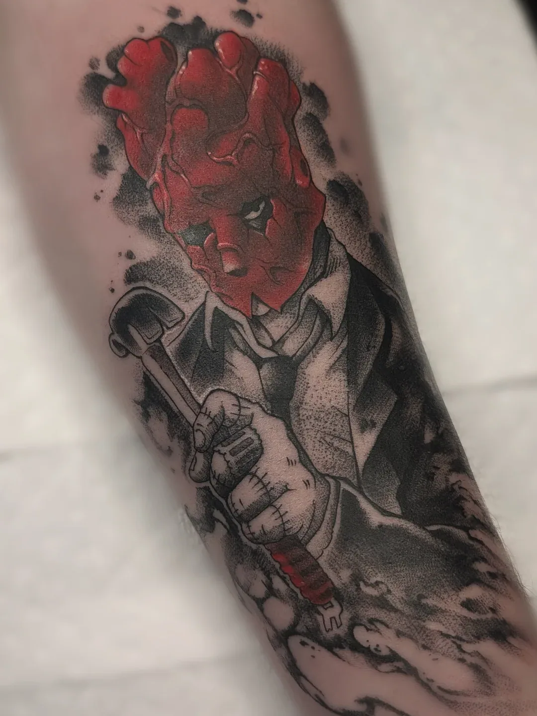 Red heart head suit cane forearm tattoo raleigh