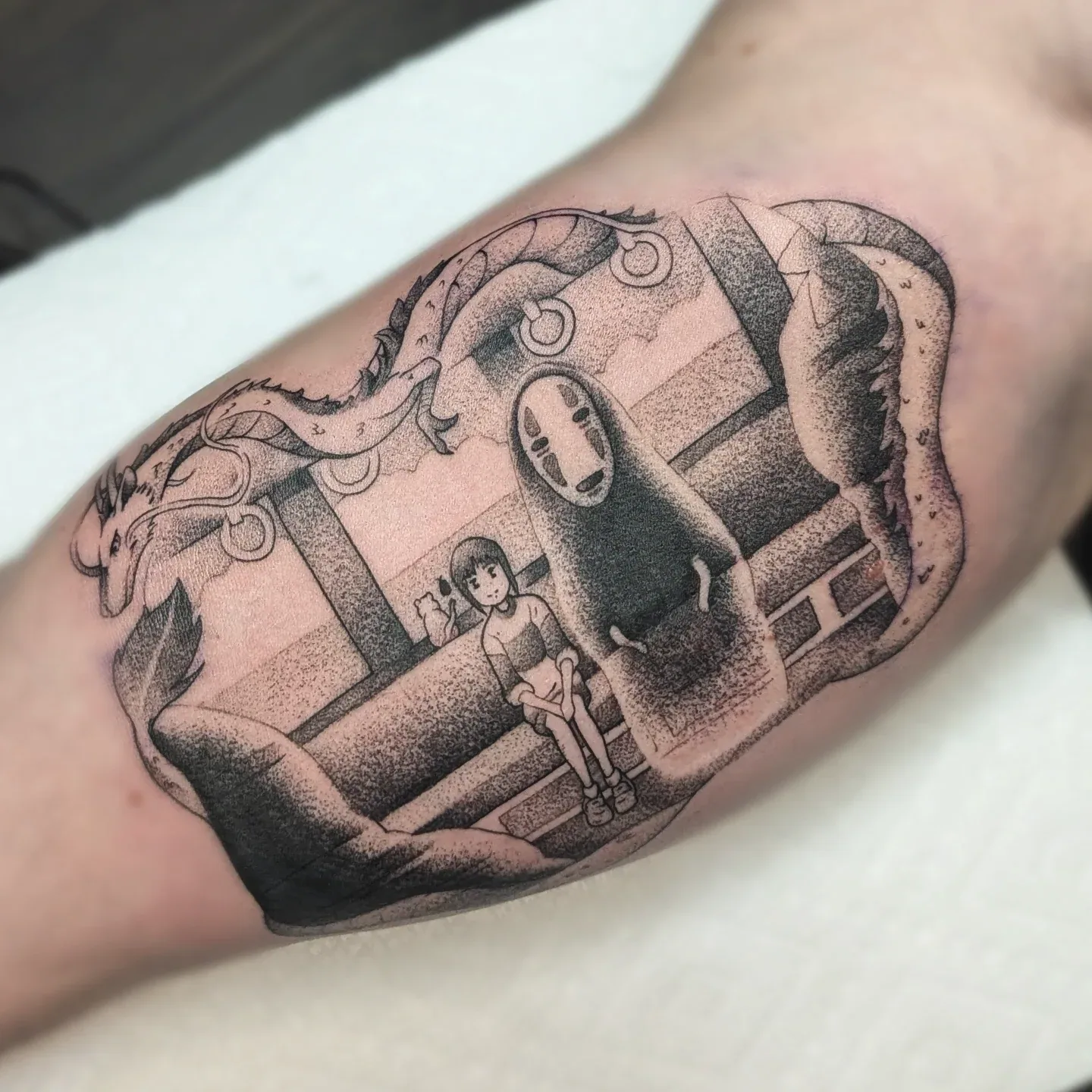 Spirited away train scene inner arm tattoo raleigh