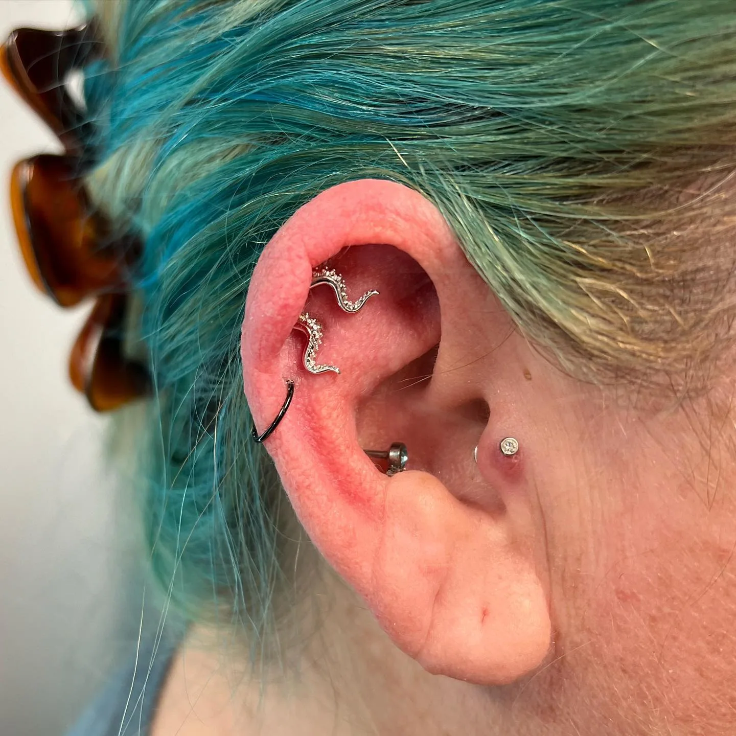 Curved helix jewelry tragus piercing raleigh