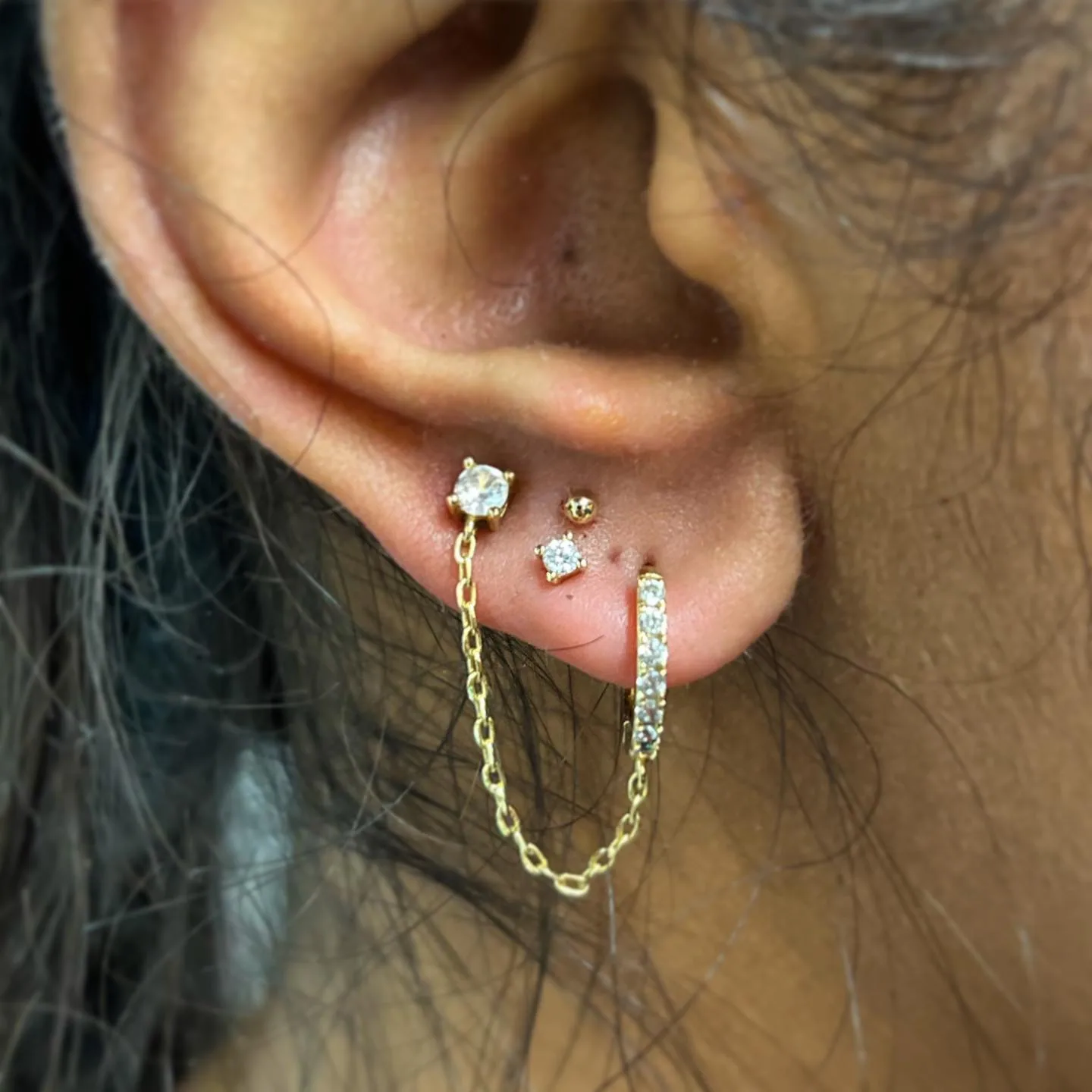Gold chain lobe piercings raleigh