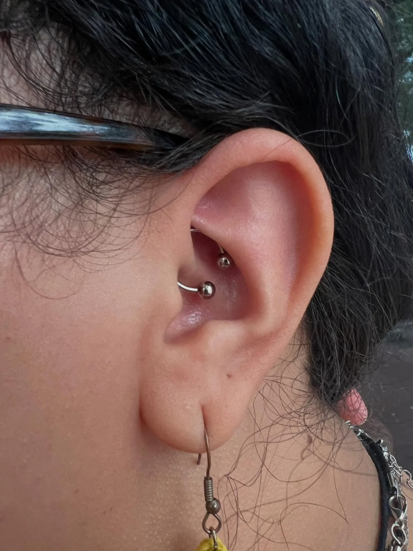 Silver rook piercing closeup raleigh