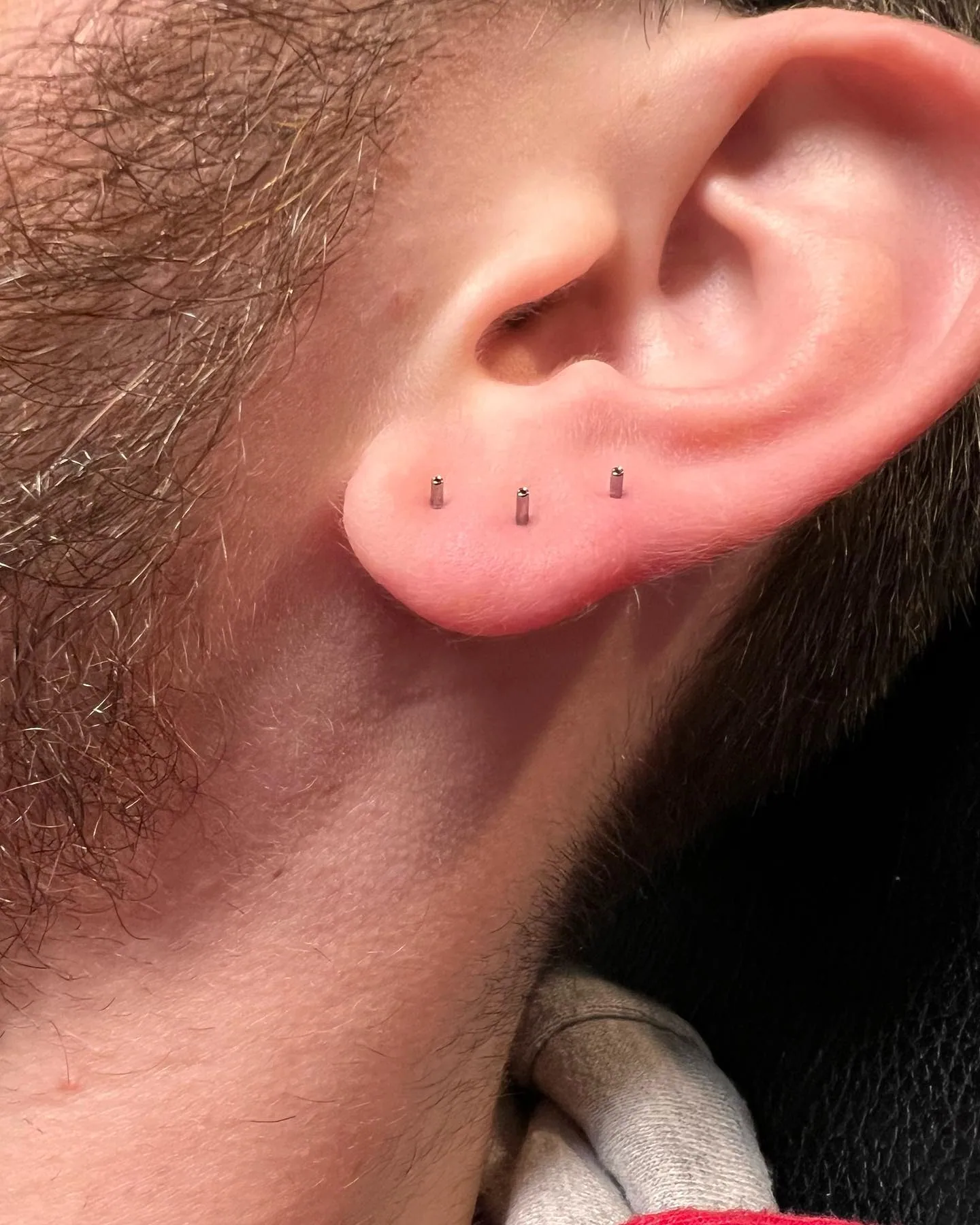 Triple lobe bar piercings raleigh