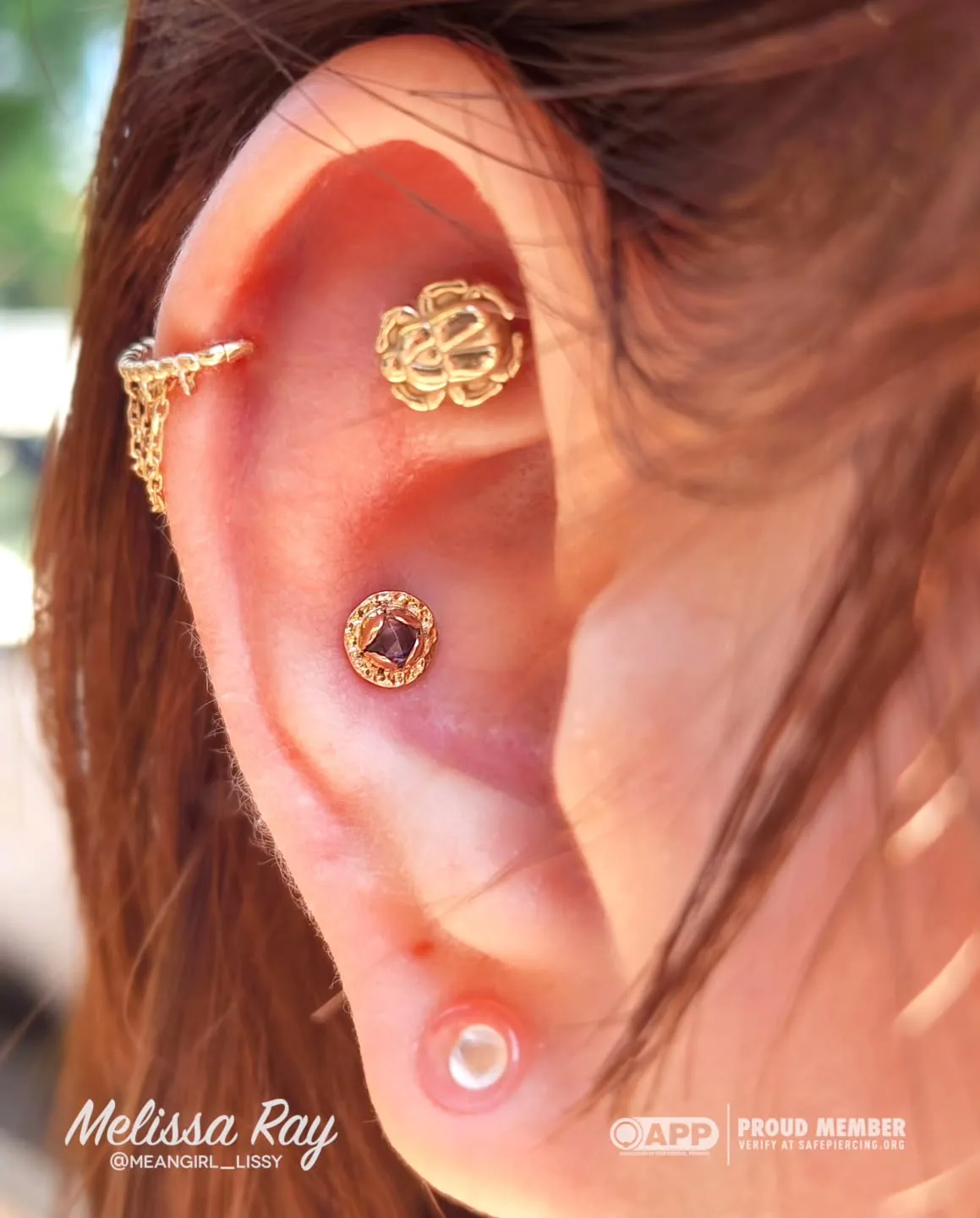 Gold chain helix piercing cluster raleigh