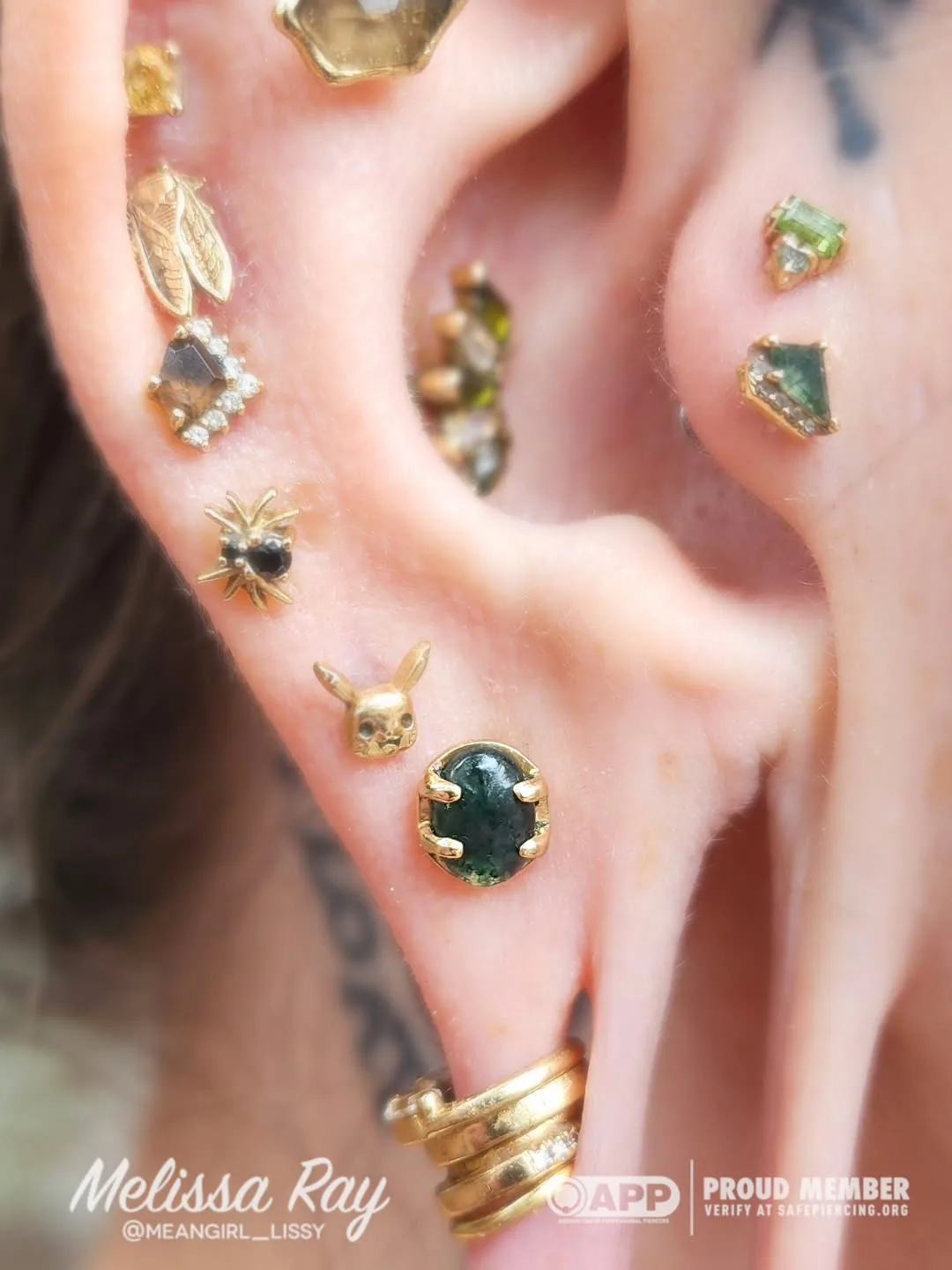 Gold green gem ear curation raleigh